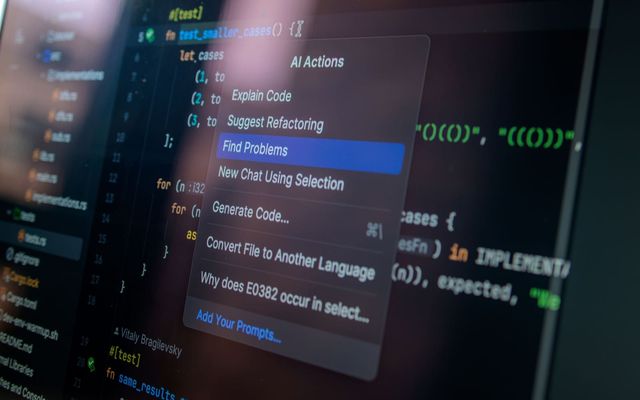 Detailed view of a computer screen displaying code with a menu of AI actions, illustrating modern software development.